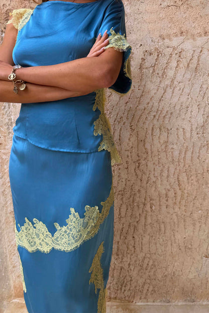 Blue and Lemon Millie Skirt co-ord in blue satin with contrast lemon lace detailing and an asymmetric hem.