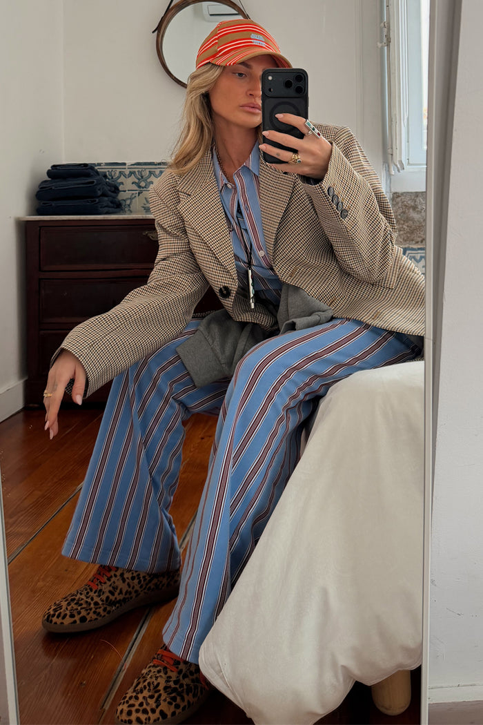 Blue Cotton Stripe Jogger with red pinstripes, styled with a checkered blazer and leopard print trainers.