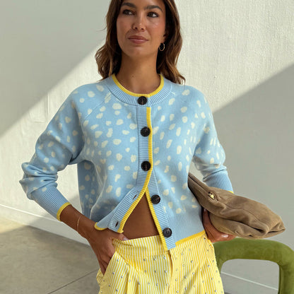 Blue Fawn Cheryl Cardigan in soft-touch blue knit with blush deer spots and yellow contrast trim.