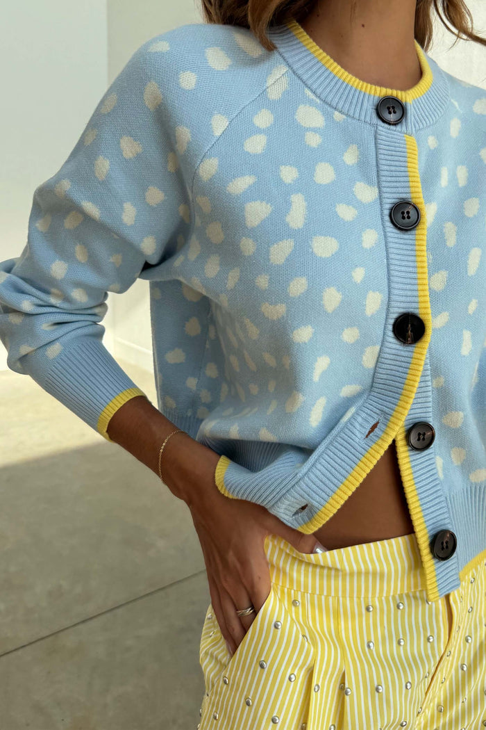 Blue Fawn Cheryl Cardigan in pale blue knit with a cream deer print and contrast yellow ribbed trims.