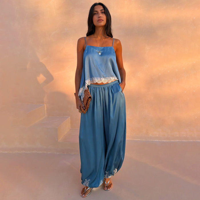 Blue Lace Balloon Trousers in washed blue satin with white lace trim and a relaxed silhouette, styled as a matching co-ord.