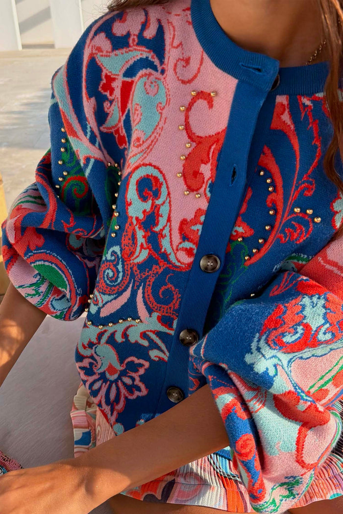 Blue Mari Cardigan in a vibrant paisley knit with gold stud accents and front button fastening.