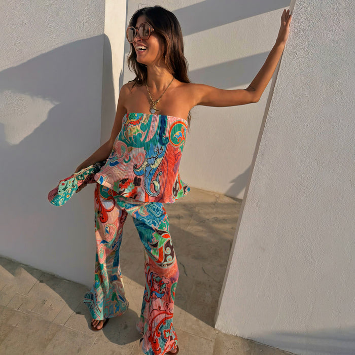 Blue Mari Plisse Bandeau Top in a paisley print, styled with matching trousers for a vacation.