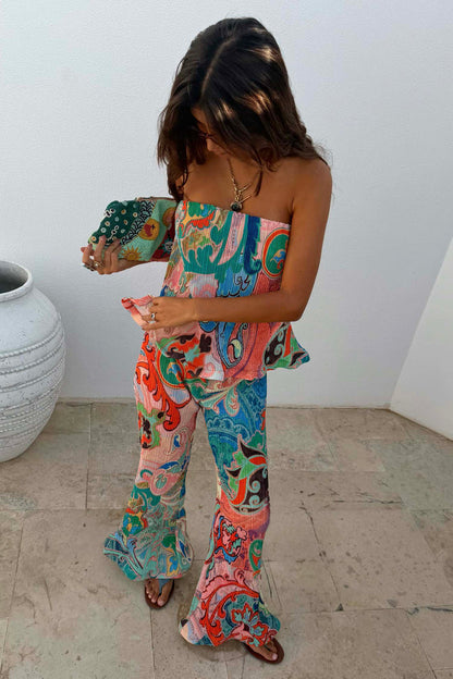 Blue Mari Plisse Trousers in a pastel paisley print, styled as a summer co-ord with a matching bandeau top.