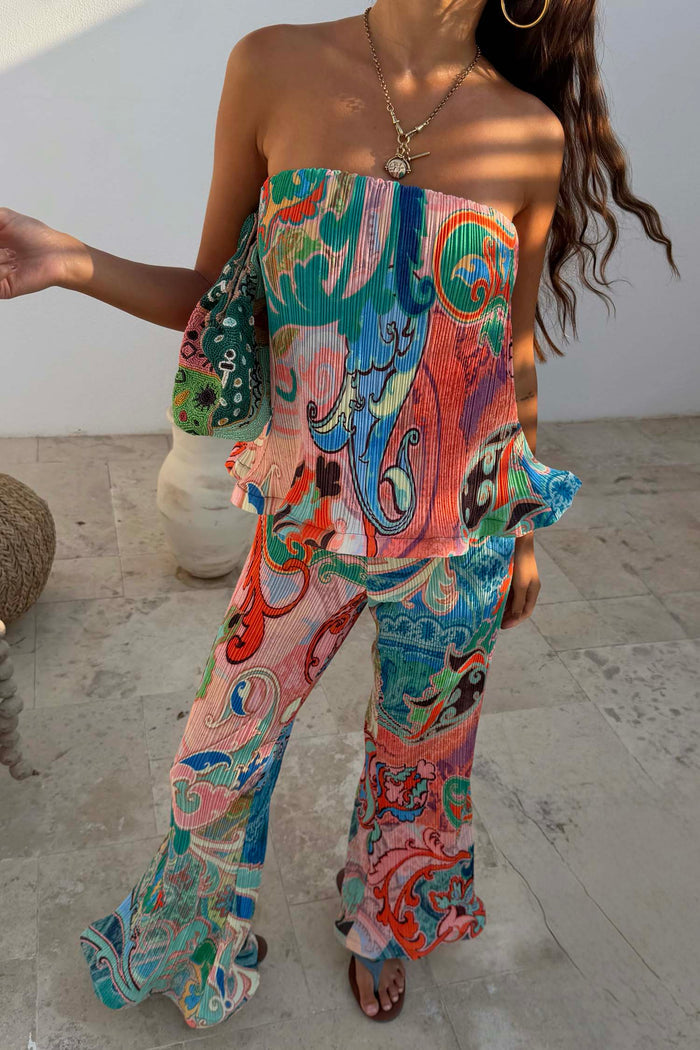 Blue Mari Plisse Trousers and matching bandeau top in a pastel paisley print, styled as a summer co-ord.