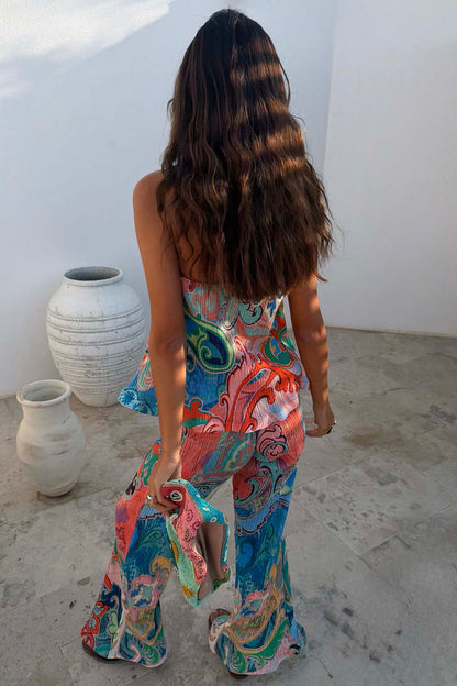 Blue Mari Plisse Trousers in a vibrant paisley Mari print and textured fabric, styled as a summer co-ord.