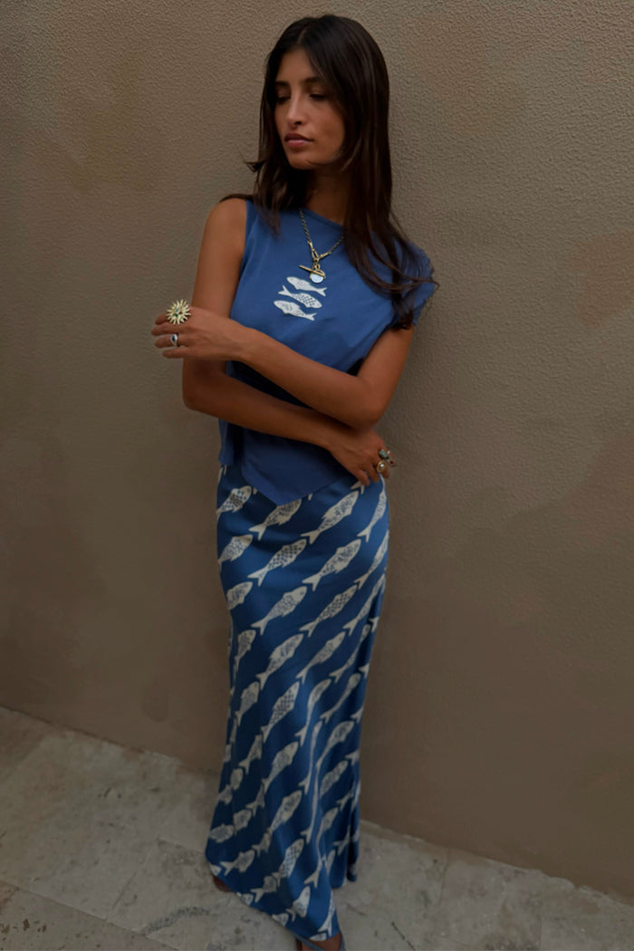 Blue Marina A-Symmetric Top with white fish motifs and a gathered waist, paired with a matching printed skirt.