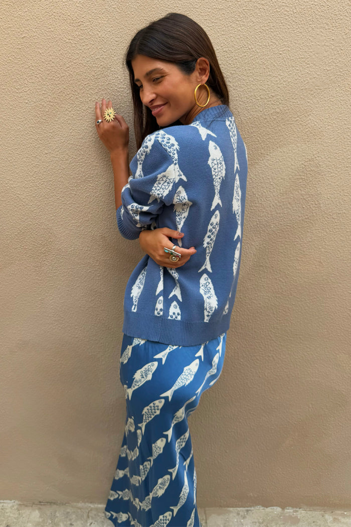 Blue Marina Hollie Cardigan with white fish motifs on a soft knit, styled with a matching co-ord skirt.