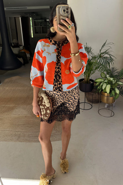 Blue Poppy Cardigan with orange poppy print and leopard trim, paired with a leopard and lace slip dress.