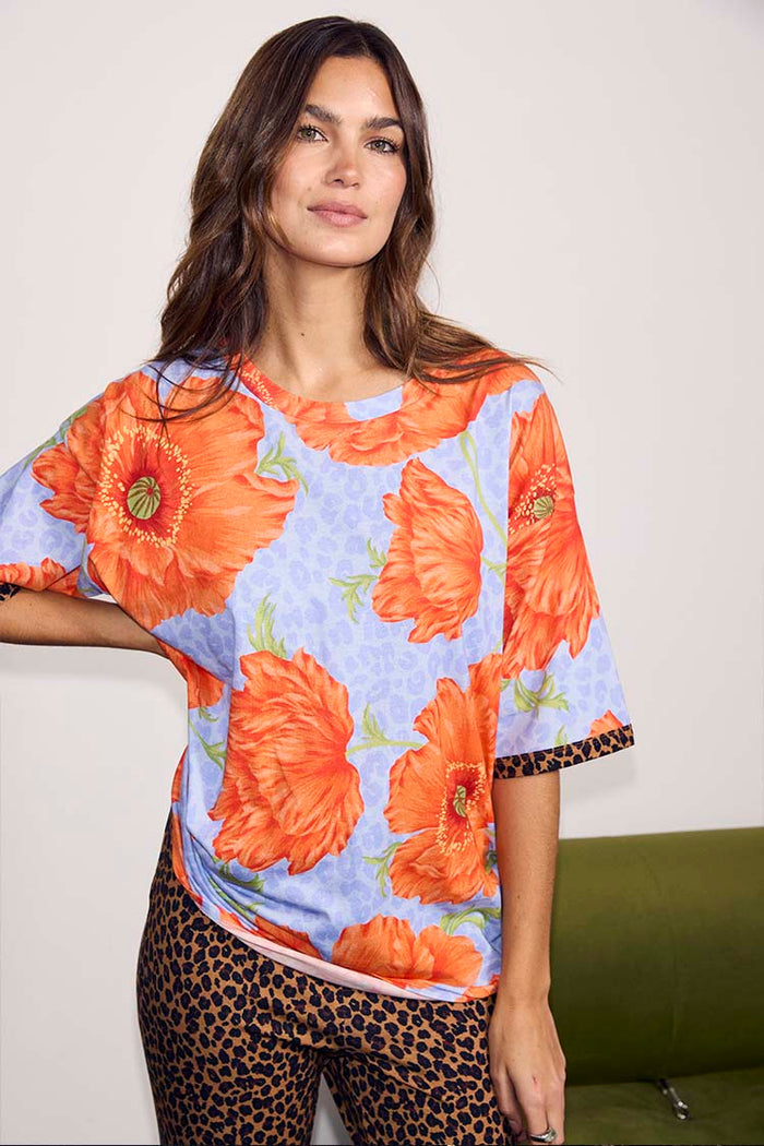 Blue Poppy Print Jersey Pyjamas featuring oversized orange poppies and leopard print accents in a soft stretch jersey.