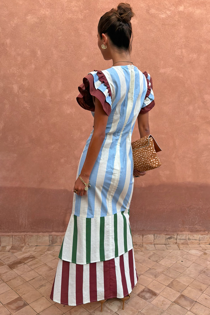 Blue Stripe Alena Midi Dress with burgundy frill sleeves and a multi-coloured tiered striped hem, back view.