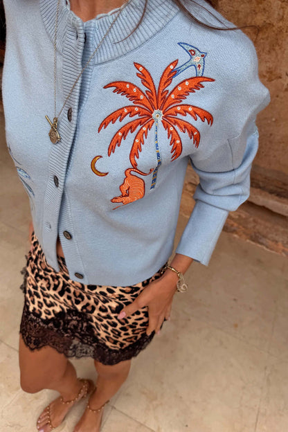 Blue Tigress Cardigan with embroidered palm tree and tiger, paired with a leopard print and lace skirt.