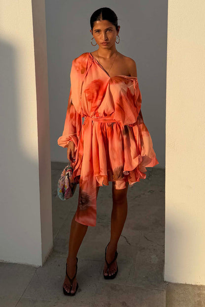 Peach orange Blurred Floral Ella Mini Dress with flute sleeves and tiered ruffle skirt, styled off-shoulder.