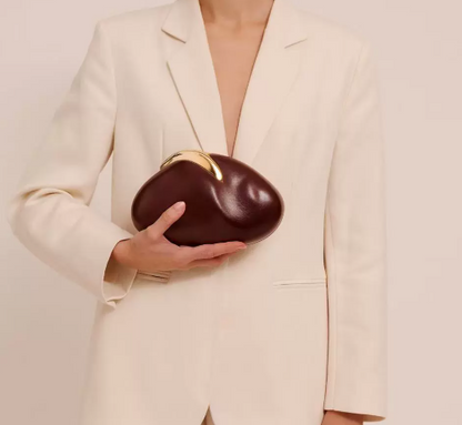 blush oval clutch with sculpted gold handle – BLUSHÉ