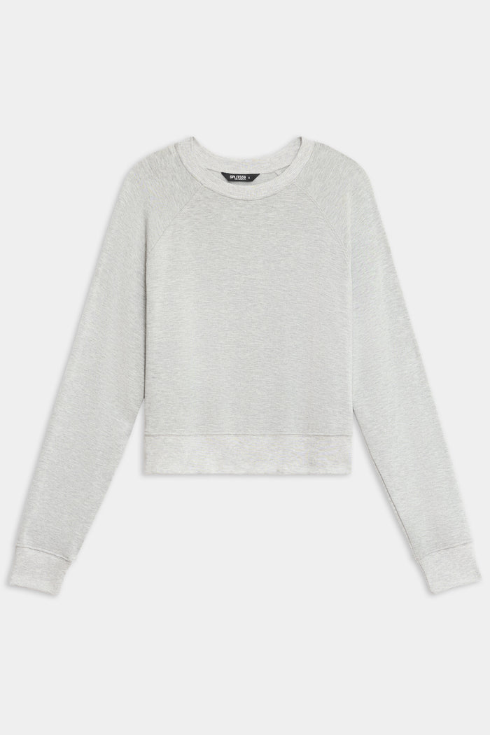 The SPLITS59 Brooks Fleece Long Sleeve Sweatshirt in light gray features a crew neck and cropped fit, shown laid flat on a white background.