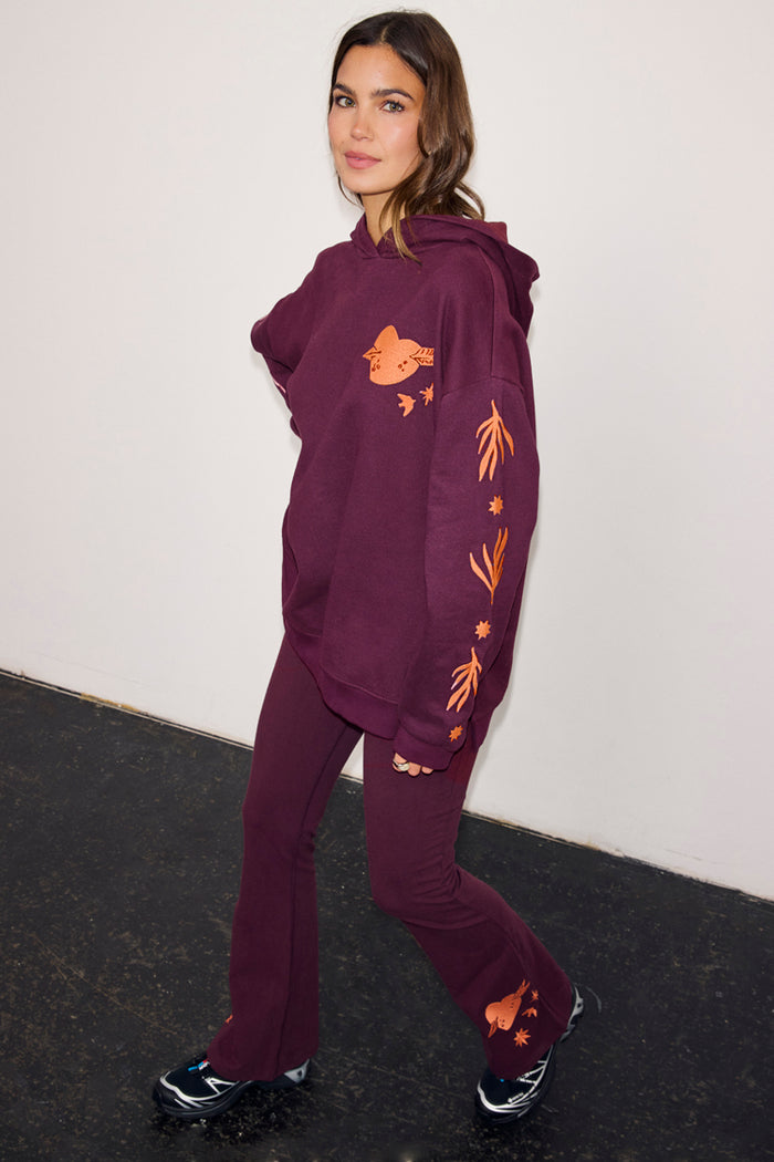 Burgundy cotton set with fit and flare pants and matching hoodie featuring coral embroidered motifs.