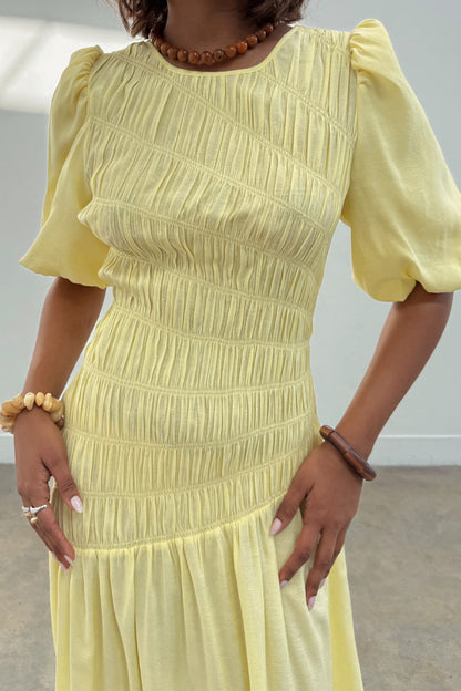 Butter Yellow Shirred Nara Dress featuring elastic shirring on the bodice and puff sleeve detail.
