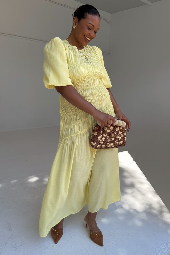 Butter Yellow Shirred Nara Dress featuring a shirred bodice and pleated midaxi skirt for inclusive sizing.