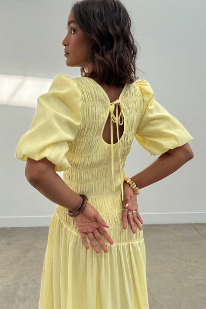 Butter Yellow Nara Dress featuring a shirred back, keyhole tie detail and puffed sleeves.
