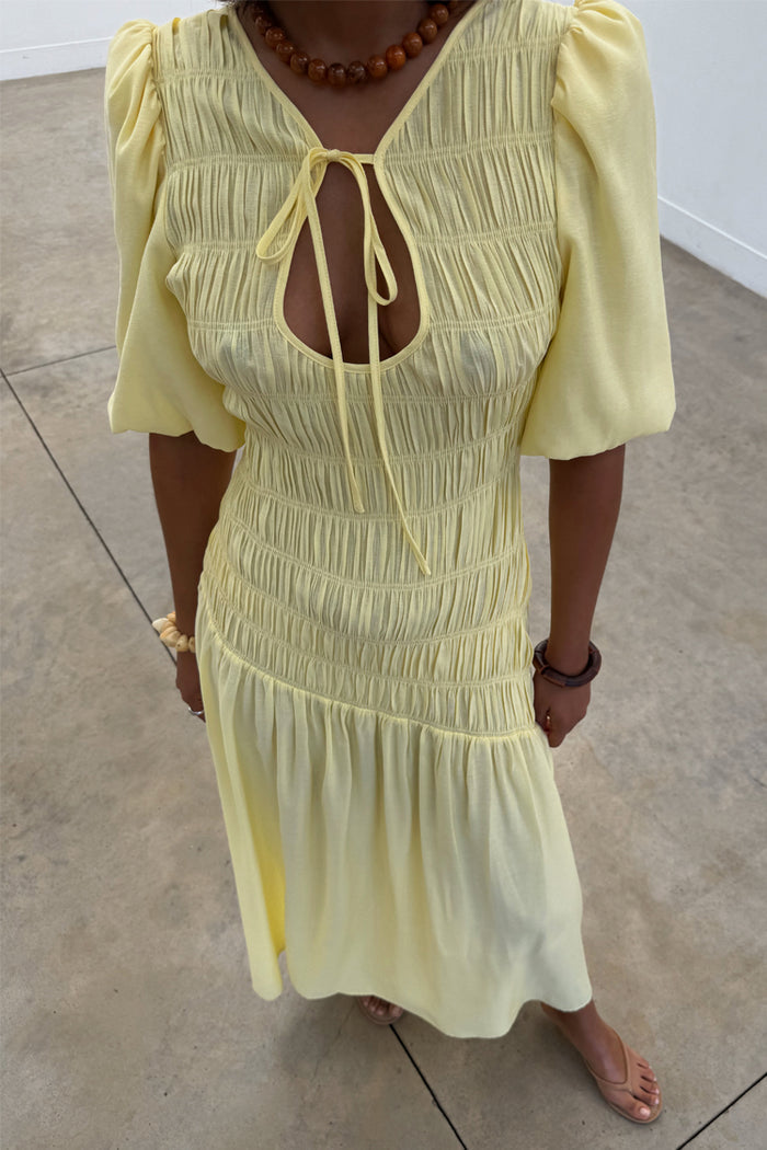 Butter Yellow Nara Dress featuring a multi-wear tie neck, shirred bodice and short puff sleeves.