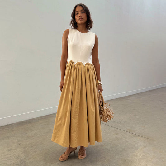 Camel Monika Dress with a white corset-style top, scalloped waist, and a beige pleated cotton midi skirt.