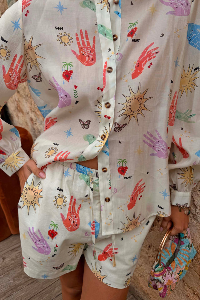 Cream cotton-linen co-ord with celestial sun and heart motifs, featuring the Marley shirt and matching shorts.