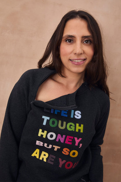 Charcoal sweatshirt featuring colourful "Life is tough honey" embroidery and a functional neckline zip.
