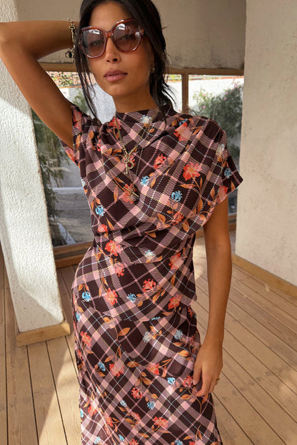 Chocolate Check Floral Top with a high neck, draped sleeves and ruched detailing, worn with sunglasses.