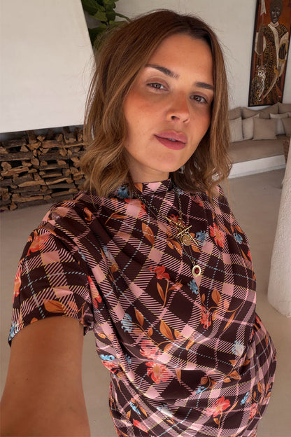 Chocolate check floral top with a high neck and draped sleeves on a model wearing UK size 18.