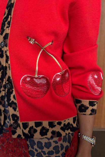 Red Cherry Holly Cardigan detail highlighting the embroidered cherry motifs and leopard print knit trim.