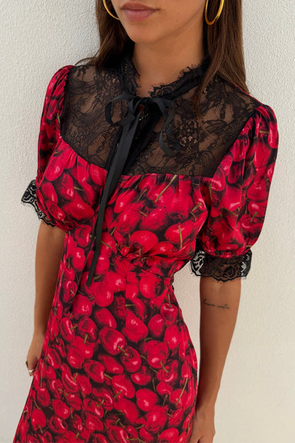 Red Cherry Lyla Dress featuring a black lace neckline, grosgrain neck tie and short sleeves with lace cuffs.