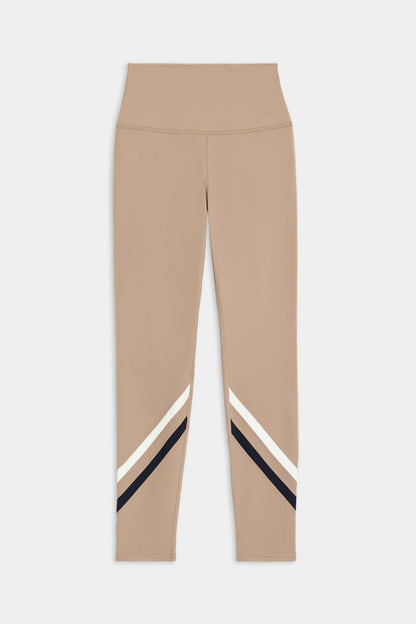 The SPLITS59 Chevron Airweight High Waist 7/8 leggings in Latte/Indigo, made from ultra-luxe fabric, feature black and white diagonal stripes near the ankles and are displayed on a white background.