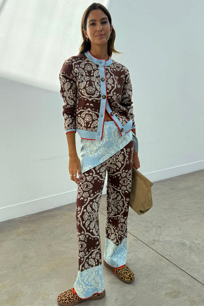 Chocolate Bandana Wide Leg Trousers with an iconic print and blue hem, styled with a matching cardigan co-ord.