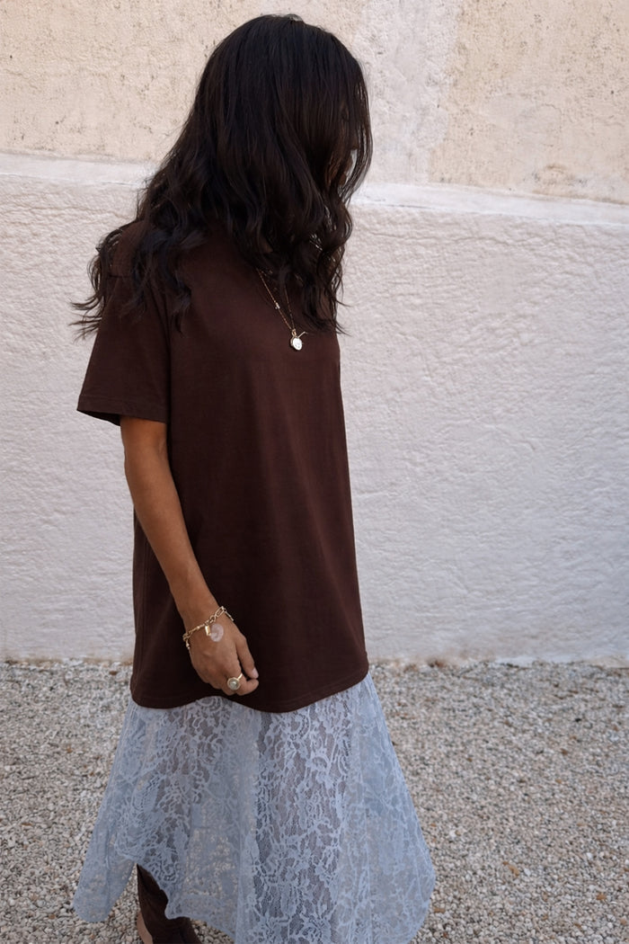 Chocolate Cara T Shirt Dress with a brown cotton top and light blue lace skirt insert, designed in London.