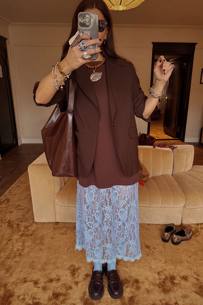 Chocolate Cara T Shirt Dress featuring a brown top and blue lace skirt, styled with a blazer for a layered London look.