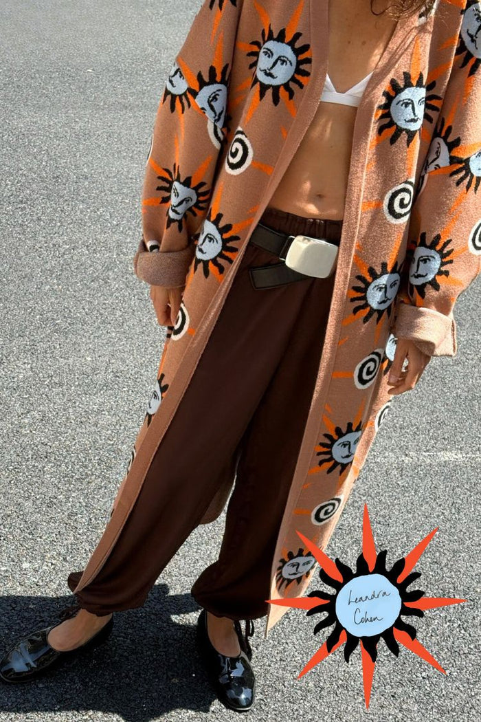 Chocolate Naomi Cargo Trousers in brown satin with a balloon leg, styled with a sun-print cardigan.