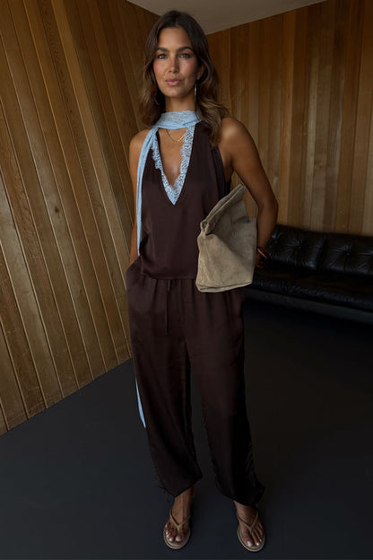 Chocolate Naomi Cargo Trousers in brown satin with a balloon leg and adjustable ties, styled with a matching lace top.