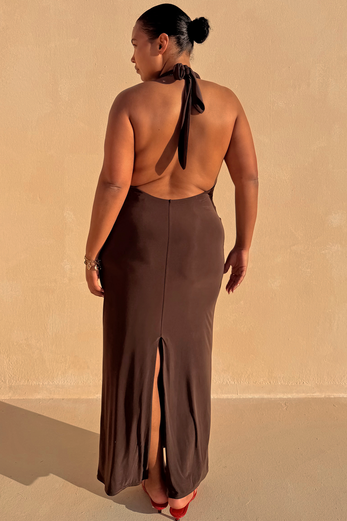Chocolate Sabine Dress featuring an open back, halter neck tie and split hem, highlighting inclusive sizing.