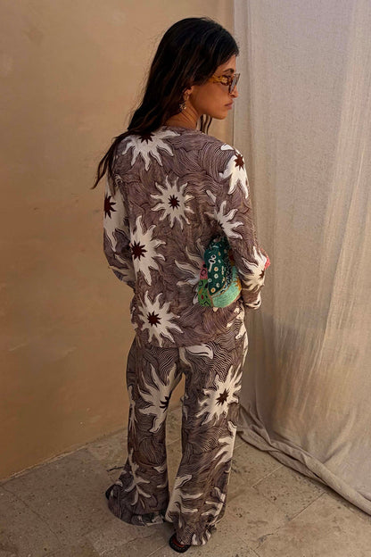 Chocolate Soleil Ellie Trousers and matching top featuring white sun motifs in a wide-leg co-ord.
