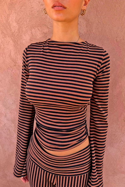Ribbed Chocolate Stripe Top with a high neck and long sleeves, paired with matching striped trousers.