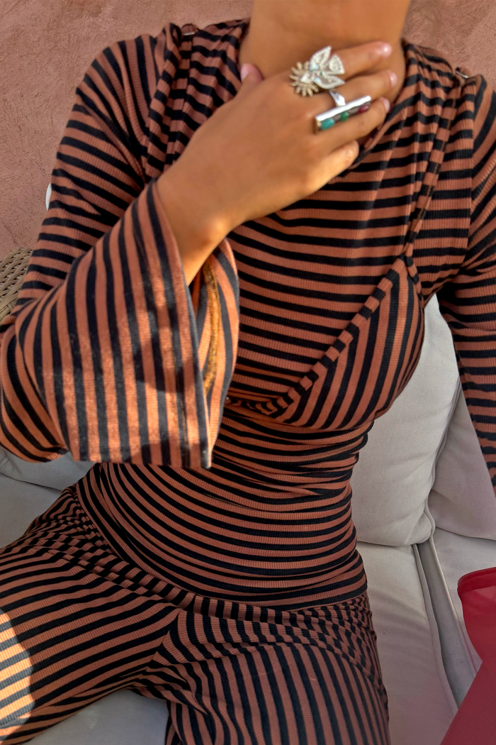 Chocolate and black stripe ribbed top with layered bra detail, flared sleeves and matching trousers.