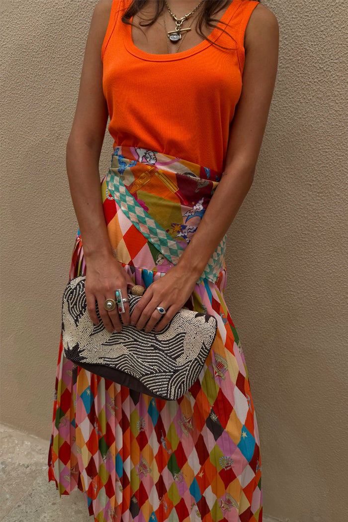 Cirque Beatrice Skirt in a colourful geometric print with cirque motifs and a pleated A-line silhouette.
