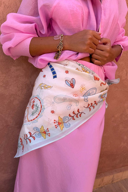 Cream Bandana in Tigress Print styled as a multi-wear waist accessory, featuring colourful paisley and motifs.