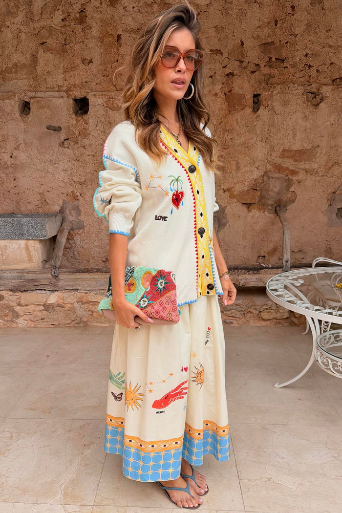 Cream Celestial Martha Cardigan in a soft touch knit with celestial motifs and a yellow hem, designed in London.