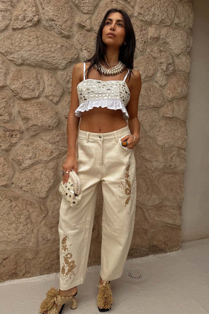 Cream Mirror Gabbi Top with glass and mirror beads and a ruffle hem, styled with cream embroidered trousers.
