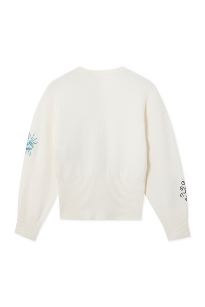 Cream Darcy Cardigan featuring neon embroidered sleeve motifs and a ribbed hem, a versatile transeasonal layer.