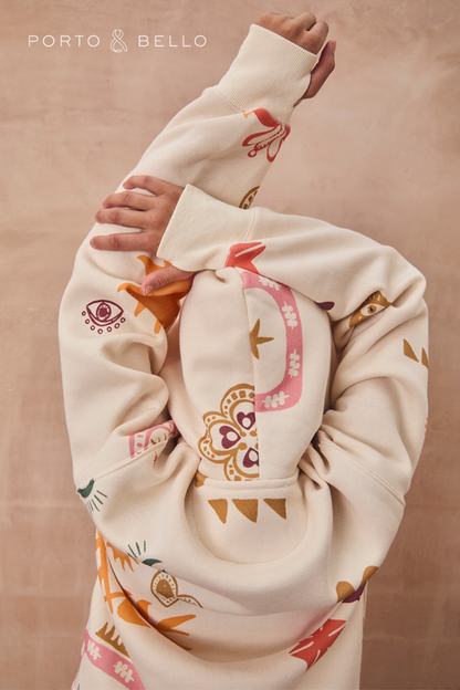 Cream Sundazed Accessible Hoodie with colourful sun, eye and star prints, showing a close-up of the back and hood.