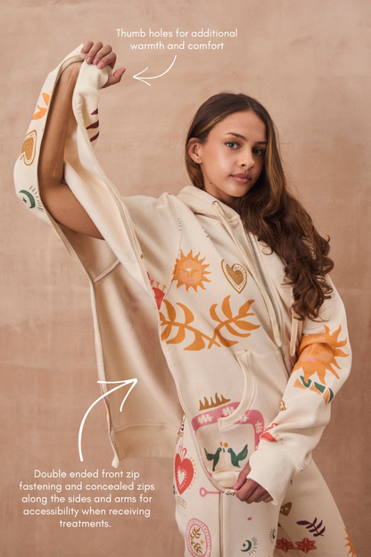 Cream Sundazed Accessible Hoodie featuring sun prints, concealed zips for treatment access, and thumb holes.