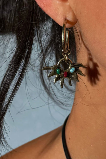 Gold-tone Deloris Sun Hoop Earring featuring a sun motif with colourful semi-precious stones, worn on the ear.