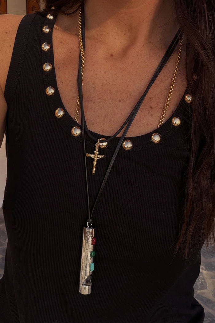 Deloris Whistle Necklace with a polished silver-tone pendant and colourful gemstones on a layered black leather cord.